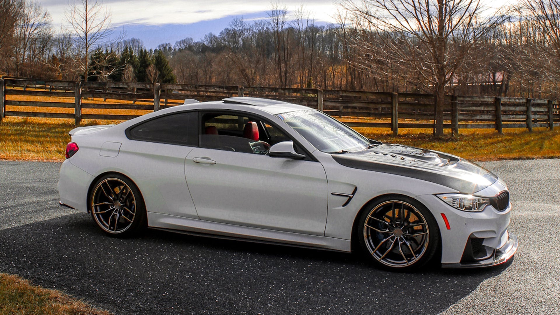 Static shot of the F82 BMW M4 parked, highlighting its stance with Krypton wheels.