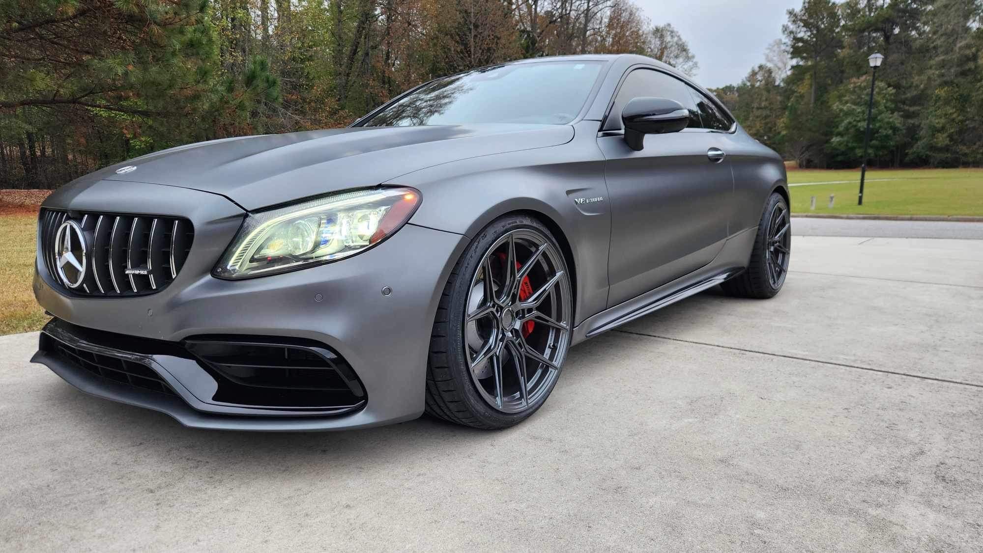 Front view of a Mercedes-Benz C63s on forged Nysa wheels from variant wheels , highlighting the aggressive stance.