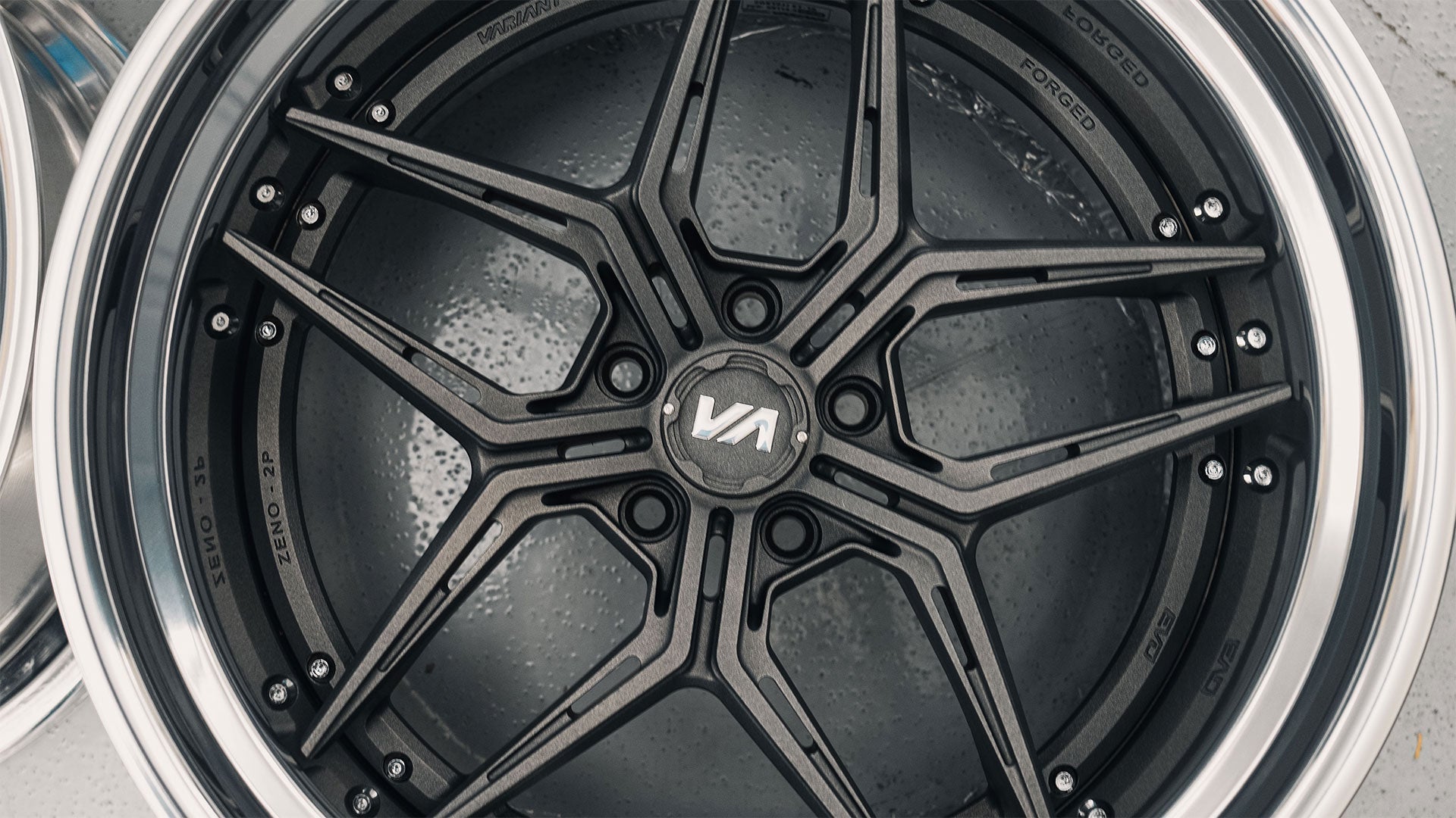 Close-up of EX2 Collection two-piece forged wheel with intricate design and custom finish